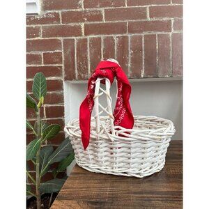 White wicker wood basket with red bandana